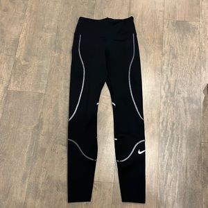 Women’s black Nike leggings.